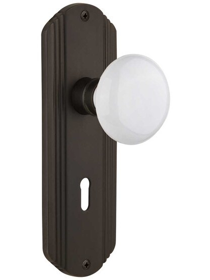 Streamline Moderne Mortise Lock Set With White Porcelain Door Knobs in Oil-Rubbed Bronze.